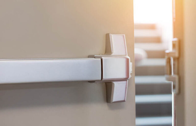 Fire door with panic bar installed for safe emergency exit in a commercial building